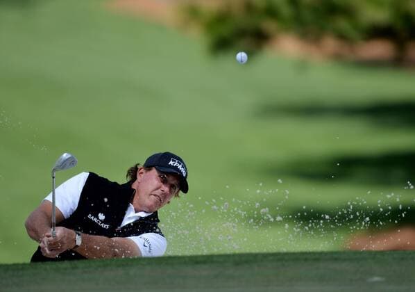 Phil Mickelson hits out of a bunker to the 7th green in the first round of the 2016 Masters Tournament at Augusta National in Augusta, Georgia on April 7, 2016.  MAS20160407154 KEVINxDIETSCH