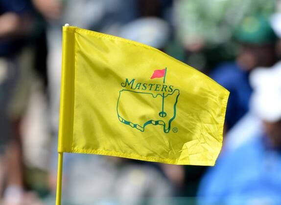 The Masters tournament flag catches the wind on the 18th hole in the first round of the 2016 Masters Tournament at Augusta National in Augusta, Georgia on April 7, 2016.  MAS20160407168 KEVINxDIETSCH