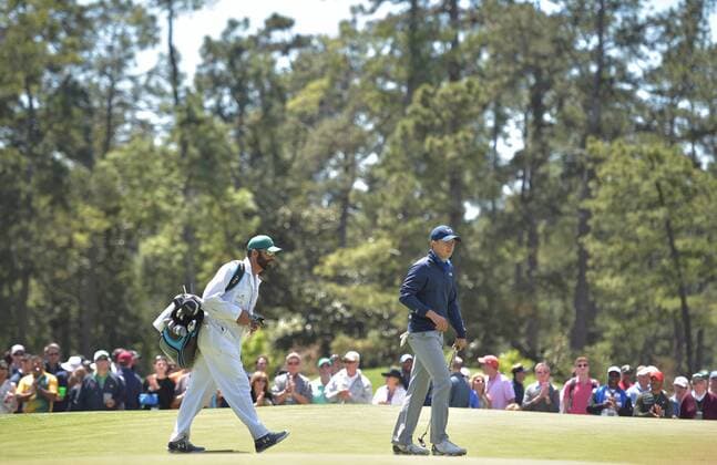 Caddie Michael Greller and Jordan Spieth walk up the first hole fairway in the second round of the 2016 Masters Tournament at Augusta National in Augusta, Georgia on April 8, 2016. Tom Watson announced that this 2016 Masters will be his last.  MAS20160408114 KEVINxDIETSCH