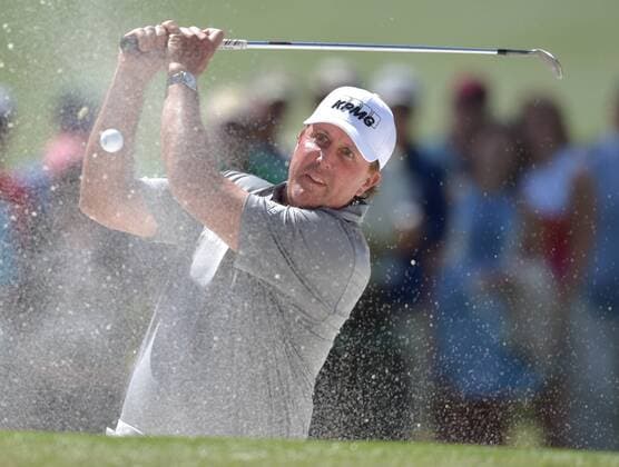 Phil Mickelson reacts after hitting a shot from a green side bunker that eventually lands back in the sand on the 7th hole in the second round of the 2016 Masters Tournament at Augusta National in Augusta, Georgia on April 8, 2016. Tom Watson announced that this 2016 Masters will be his last.  MAS20160408142 KEVINxDIETSCH