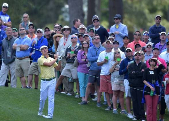 Fans watch Bryson DeChambeau hit a shot on the 3rd hole in the second round of the 2016 Masters Tournament at Augusta National in Augusta, Georgia on April 8, 2016.  MAS20160408156 KEVINxDIETSCH