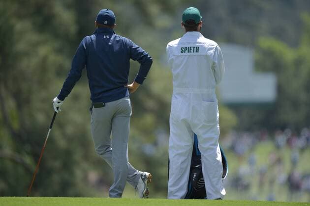 Caddie Michael Greller stands with Jordan Spieth who waits to hit a ball in the second round of the 2016 Masters Tournament at Augusta National in Augusta, Georgia on April 8, 2016. Tom Watson announced that this 2016 Masters will be his last.  MAS20160408147 KEVINxDIETSCH