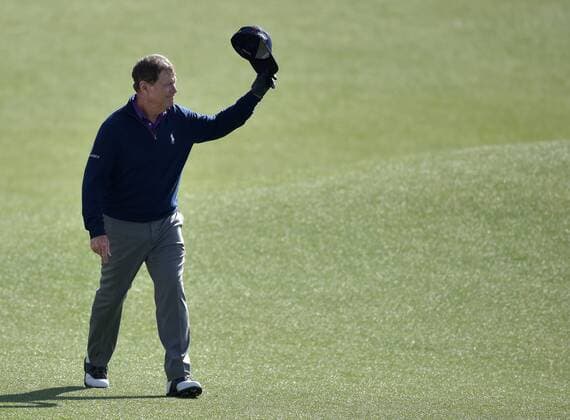 Tom Watson tips his hat and reacts to the crowds ovation as he walks up the fairway to the 18th green in the second round of the 2016 Masters Tournament at Augusta National in Augusta, Georgia on April 8, 2016. Tom Watson missed the cut with a score of 8 over par in his last ever Masters.  MAS20160408170 KEVINxDIETSCH