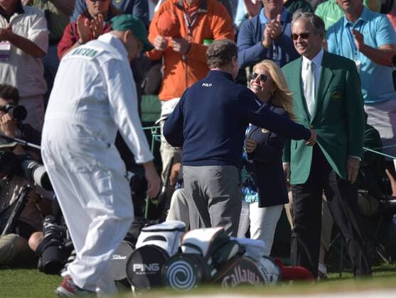 Tom Watson walks over to hug Hilary Watson after his round on the 18th green in the second round of the 2016 Masters Tournament at Augusta National in Augusta, Georgia on April 8, 2016. Tom Watson missed the cut with a score of 8 over par in his last ever Masters.  MAS20160408999 KEVINxDIETSCH
