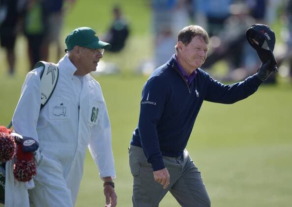 Caddie Neil Oxman walks with Tom Watson who tips his hat and reacts to the crowds ovation as he walks up the fairway to the 18th green in the second round of the 2016 Masters Tournament at Augusta National in Augusta, Georgia on April 8, 2016. Tom Watson missed the cut with a score of 8 over par in his last ever Masters.  MAS20160408166 KEVINxDIETSCH