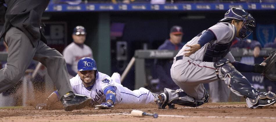 April 8, 2016 - Kansas City, MO, USA - The Kansas City Royals Omar Infante scores behind Minnesota Twins catcher Kurt Suzuki on a two-run single by Reymond Fuentes in the second inning on Friday, April 8, 2016, at Kauffman Stadium in Kansas City, Mo. Minnesota at Kansas City - ZUMAm67_