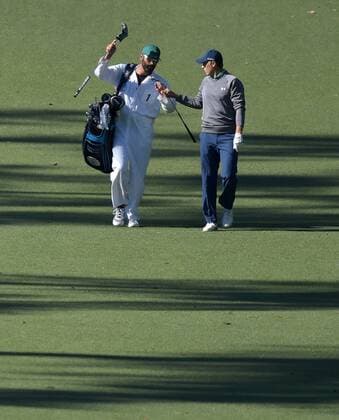 Caddie Michael Greller and Jordan Spieth walk to the 10th green in the third round of the 2016 Masters Tournament at Augusta National in Augusta, Georgia on April 9, 2016.  MAS20160409154 KEVINxDIETSCH