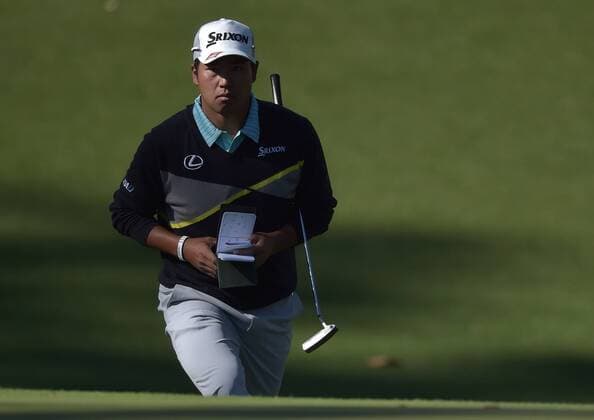Hideki Matsuyama of Japan walks with his putter to the 10th green in the third round of the 2016 Masters Tournament at Augusta National in Augusta, Georgia on April 9, 2016.  MAS20160409146 KEVINxDIETSCH