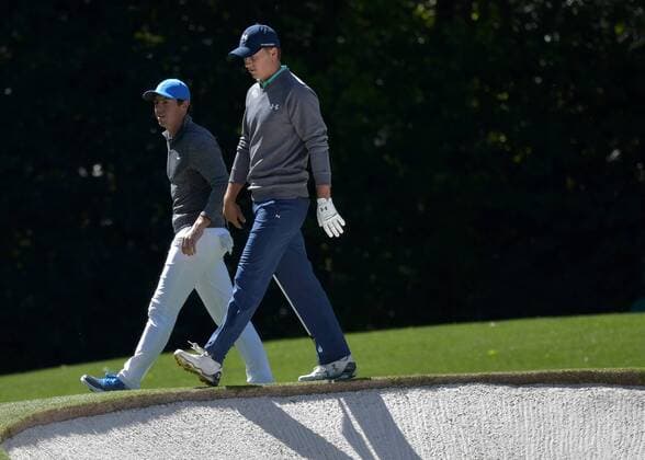 Rory McIllroy of Northern Ireland and Jordan Spieth walk off of the 10th green in the third round of the 2016 Masters Tournament at Augusta National in Augusta, Georgia on April 9, 2016.  MAS20160409156 KEVINxDIETSCH