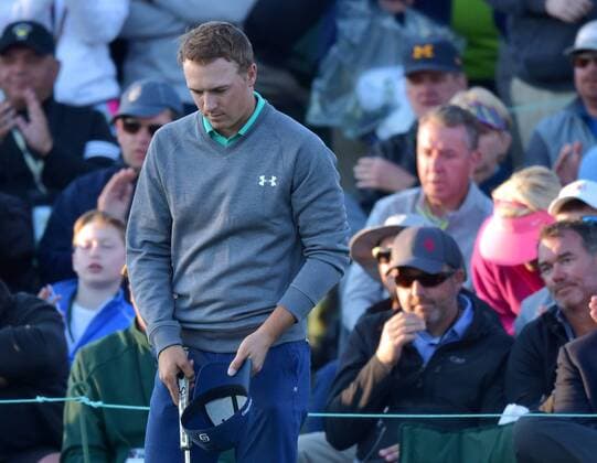 Jordan Spieth takes off his hat on the 18th hole after his round in the third round of the 2016 Masters Tournament at Augusta National in Augusta, Georgia on April 9, 2016.  MAS20160409161 KEVINxDIETSCH