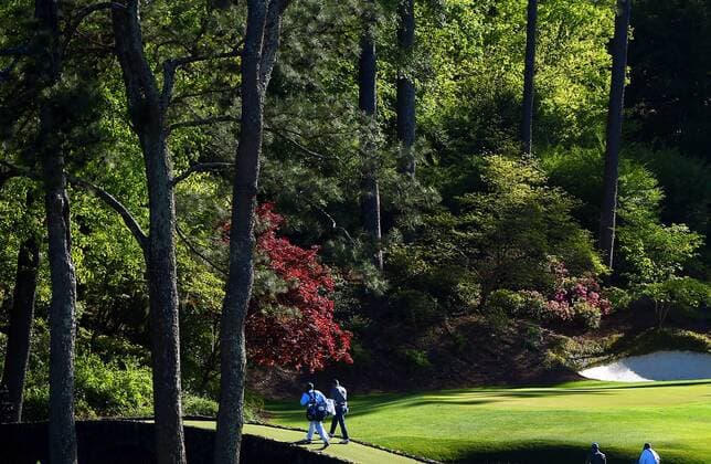 April 9, 2016 - Augusta, GA, USA - Jordan Spieth and caddie, Michael Greller, walk across the Hogan Bridge to the 12th green during the third round of the 80th Masters at the Augusta National Golf Club in Augusta, Ga., on Saturday, April 9, 2016. Masters, third round - ZUMAm67_