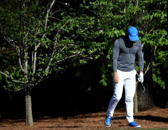 April 9, 2016 - Augusta, GA, USA - Rory McIlroy reacts after hitting his ball from the rough along the 11th fairway during the third round of the 80th Masters at the Augusta National Golf Club in Augusta, Ga., on Saturday, April 9, 2016. Masters, third round - ZUMAm67_
