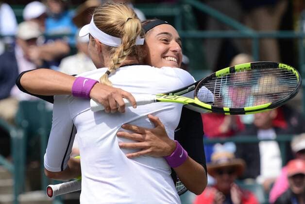 April 10, 2016 - Charleston, South Carolina, United States - CAROLINE GARCIA and KRISTINA MLADENOVIC of France celebrate winning the doubles title at the Volvo Car Open Tennis 2016 - Volvo Car Open - Day 7 - ZUMAl132