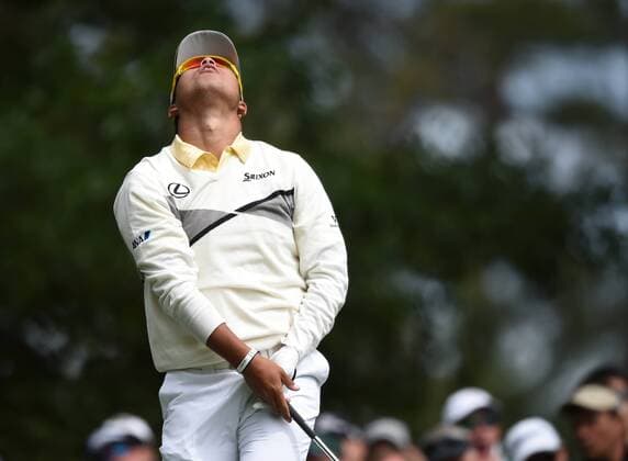 Hideki Matsuyama of Japan reacts after he hits his tee shot on the 4th hole in the final round of the 2016 Masters Tournament at Augusta National in Augusta, Georgia on April 10, 2016.  MAS20160410105 KEVINxDIETSCH
