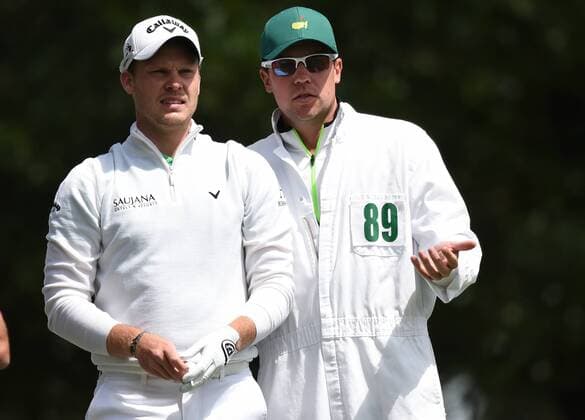Danny Willett of England and caddie Jonathan Smart stand on the 4th hole tee box in the final round of the 2016 Masters Tournament at Augusta National in Augusta, Georgia on April 10, 2016.  MAS20160410133 KEVINxDIETSCH