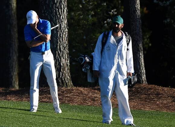 Caddie Michael Greller stands near Jordan Spieth who reacts in the 18th fairway in the final round of the 2016 Masters Tournament at Augusta National in Augusta, Georgia on April 10, 2016. Spieth lost control of the round after making a score of 7 on the par 3 12th hole knocking 2 balls into the water and failed to repeat as Masters champion. Danny Willett won in his second Masters and he became the first player from England to win the green jacket since Nick Faldo in 1996.  MAS20160410145 KEVINxDIETSCH