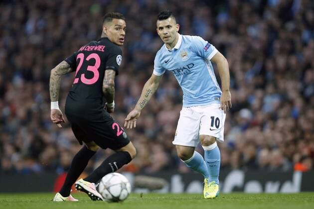 Sergio Aguero of Manchester City plays the ball past Gregory van der Wiel of PSG during the UEFA Champions League Quarter Final match at the Etihad Stadium. Photo credit should read: Philip Oldham Sportimage EDITORIAL USE ONLY. No use with unauthorised audio, video, data, fixture lists, club league logos or live services. Online in-match use limited to 120 images, no video emulation. No use in betting, games or single club league player publications.