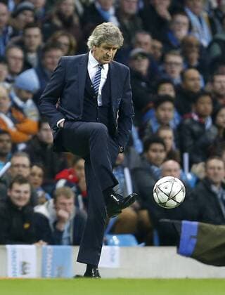 Manuel Pellegrini, manager of Manchester City chips the ball during the UEFA Champions League Quarter Final match at the Etihad Stadium. Photo credit should read: Philip Oldham Sportimage EDITORIAL USE ONLY. No use with unauthorised audio, video, data, fixture lists, club league logos or live services. Online in-match use limited to 120 images, no video emulation. No use in betting, games or single club league player publications.