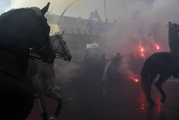 Spain: Thousands welcome Real Madrid s players Real Madrid fans light flares as the players arrive at the Santiago Bernabeu stadium before the UEFA Champions League quarter-final match with VFL Wolfsburg.  JorgexSanz