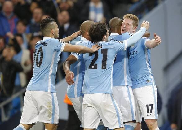 Kevin De Bruyne of Manchester City (r) is mobbed after scoring the first goal during the UEFA Champions League match at The Etihad Stadium. Photo credit should read: Simon Bellis Sportimage EDITORIAL USE ONLY. No use with unauthorised audio, video, data, fixture lists, club league logos or live services. Online in-match use limited to 120 images, no video emulation. No use in betting, games or single club league player publications.