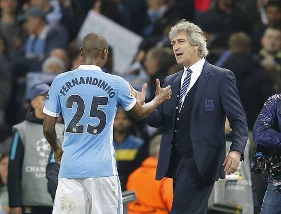 Manuel Pellegrini manager of Manchester City greets Fernandinho of Manchester City at the end of the match during the UEFA Champions League match at The Etihad Stadium. Photo credit should read: Simon Bellis Sportimage EDITORIAL USE ONLY. No use with unauthorised audio, video, data, fixture lists, club league logos or live services. Online in-match use limited to 120 images, no video emulation. No use in betting, games or single club league player publications.