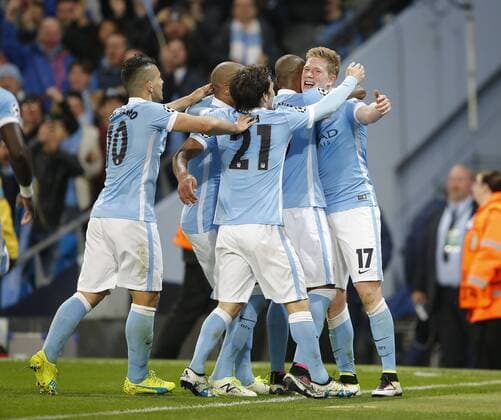 Kevin De Bruyne of Manchester City is mobbed after scoring the winning goal during the UEFA Champions League match at The Etihad Stadium. Photo credit should read: Simon Bellis Sportimage EDITORIAL USE ONLY. No use with unauthorised audio, video, data, fixture lists, club league logos or live services. Online in-match use limited to 120 images, no video emulation. No use in betting, games or single club league player publications.