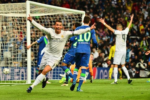 April 12, 2016 - Madrid, Spain - Cristiano Ronaldo of Real Madrid celebrates after scoring his team s first goal during the UEFA Champions League quarter final second leg match between Real Madrid and VfL Wolfsburg at Estadio Santiago Bernabeu on April 12, 2016 in Madrid, Spain. Real Madrid CF v VfL Wolfsburg - UEFA Champions League Quarter Final: Second Leg  - ZUMAn230