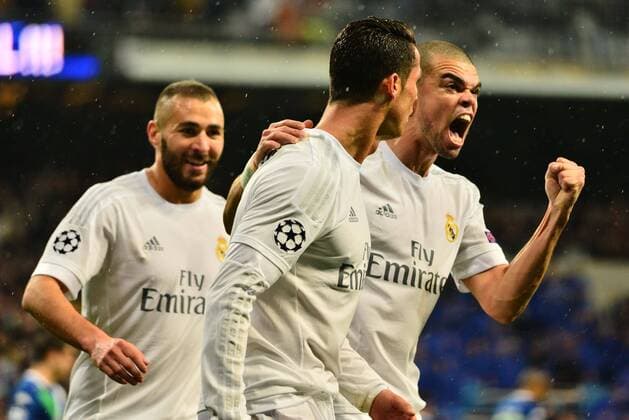 April 12, 2016 - Madrid, Spain - Cristiano Ronaldo (C) of Real Madrid celebrates after scoring his team s second goal with Pepe (R) and Benzema (R) during the UEFA Champions League quarter final second leg match between Real Madrid and VfL Wolfsburg at Estadio Santiago Bernabeu on April 12, 2016 in Madrid, Spain. Real Madrid CF v VfL Wolfsburg - UEFA Champions League Quarter Final: Second Leg  - ZUMAn230