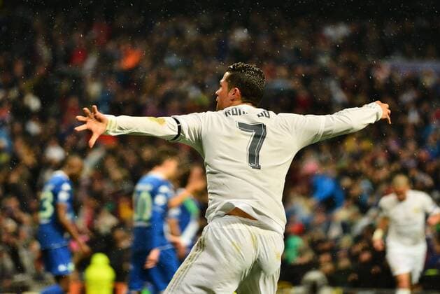 April 12, 2016 - Madrid, Spain - Cristiano Ronaldo of Real Madrid celebrates after scoring his team s second goal during the UEFA Champions League quarter final second leg match between Real Madrid and VfL Wolfsburg at Estadio Santiago Bernabeu on April 12, 2016 in Madrid, Spain. Real Madrid CF v VfL Wolfsburg - UEFA Champions League Quarter Final: Second Leg  - ZUMAn230