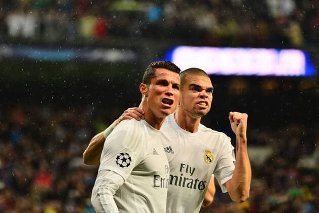 April 12, 2016 - Madrid, Spain - Cristiano Ronaldo (L) of Real Madrid celebrates after scoring his team s second goal with Pepe (R) during the UEFA Champions League quarter final second leg match between Real Madrid and VfL Wolfsburg at Estadio Santiago Bernabeu on April 12, 2016 in Madrid, Spain. Real Madrid CF v VfL Wolfsburg - UEFA Champions League Quarter Final: Second Leg  - ZUMAn230