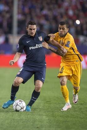 Atletico de Madrid s Koke and FC Barcelona Barca Dani Alves during Champions League 2015 2016 Quarter-Finals 2nd leg match. April 13, 2016.  (20160413052)