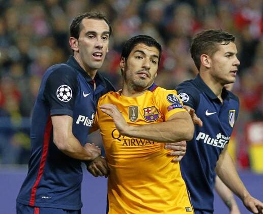 Second leg of Football 1 4 Champions League match between Atletico Madrid and FC Barcelona Barca. In this picture, Godin and Luis Suarez. xRAFAxCASALx 