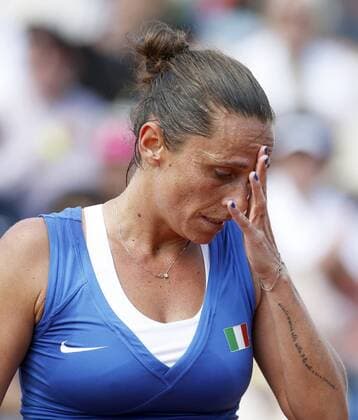 Italian Federation Cup team s member Roberta Vinci reacts after losing an action before Spaniard Garbine Muguruza during the third match of Federation Cup s World Group play-off round at Lleida tennis club, northeastern Spain, 17 April 2016. Muguruza won 6-2 and 6-2 for Spain defeates Italy in the play-off round after winning three matches. EFE Andreu Dalmau Spain vs. Italy !ACHTUNG: NUR REDAKTIONELLE NUTZUNG!  GRA138 20160417-635965000153509327
