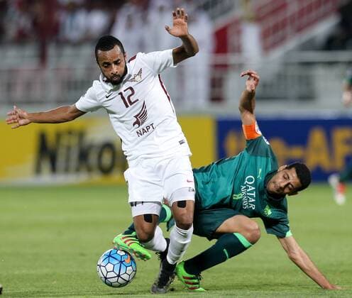 (160420) -- DOHA, April 20, 2016 -- Magid Mohamed (L) of El Jaish vies with Taiseer Al Jassam of Al Ahli during the AFC Asian Champions League Group D football match between Saudi Arabia s Al Ahli and Qatar s El Jaish in Doha, Qatar, April 19, 2016. Al Ahli won 4-1. ) (SP)QATAR-DOHA-SOCCER-AFC ASIAN CHAMPIONS LEAGUE Nikku 