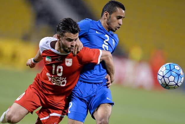 (160420) -- DOHA, April 20, 2016 -- Mohammed Alburayk (R) of Al Hilal vies with Soroush Rafiei of Tractor Sazi Tabriz during the AFC Asian Champions League Group C football match between Iran s Tractor Sazi Tabriz and Saudi Arabia s Al Hilal in Doha, Qatar, April 19, 2016. Tractor Sazi Tabriz won 2-0. (Xinhua ) (SP)QATAR-DOHA-SOCCER-AFC ASIAN CHAMPIONS LEAGUE Nikku 