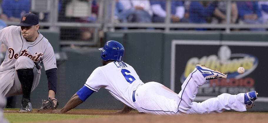 April 21, 2016 - Kansas City, MO, USA - The throw to Detroit Tigers third baseman Nick Castellanos, left, bounces past the Kansas City Royals Lorenzo Cain (6) as he steals third and then advances home on the error in the fourth inning on Thursday, April 21, 2016, at Kauffman Stadium in Kansas City, Mo. Detroit at Kansas City - ZUMAm67_