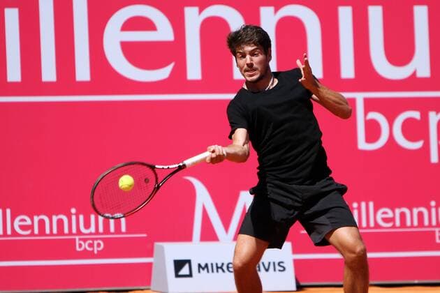 April 23, 2016 - Estoril, Portugal - Joo Domingues of Portugal returns a ball to Franko Skugor of Croatia during the Qualifying of the Millennium Estoril Open ATP Tennis Herren 250 tennis tournament at the Clube de Tnis do Estoril in Portugal on April 25, 2016. Millennium Estoril Open  - ZUMAn230