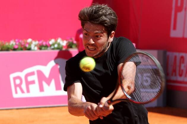April 23, 2016 - Estoril, Portugal - Joo Domingues of Portugal returns a ball to Franko Skugor of Croatia during the Qualifying of the Millennium Estoril Open ATP Tennis Herren 250 tennis tournament at the Clube de Tnis do Estoril in Portugal on April 25, 2016. Millennium Estoril Open  - ZUMAn230