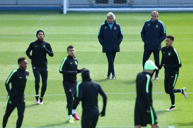 Manuel Pellegrini, manager of Manchester City watches on during the UEFA Champions League training at the Etihad Campus. Photo credit should read: Philip Oldham Sportimage EDITORIAL USE ONLY. No use with unauthorised audio, video, data, fixture lists, club league logos or live services. Online in-match use limited to 120 images, no video emulation. No use in betting, games or single club league player publications.