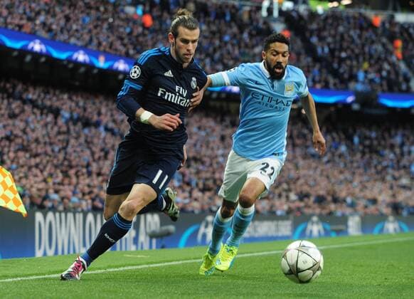 Football - 2015 2016 Champions League - Semi-Final, First Leg: Manchester City vs. Real Madrid Gareth Bale of Real Madrid and Gael Clichy of Man City at the Etihad Stadium. COLORSPORT ANDREW COWIE 