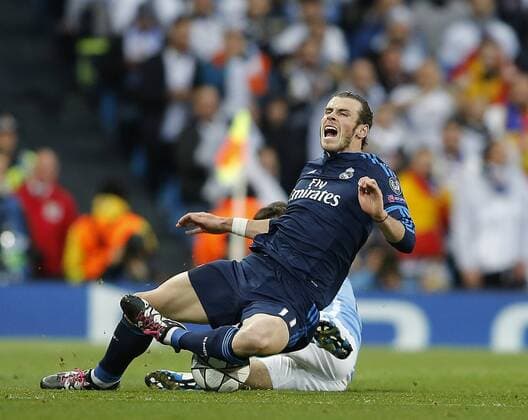 Gareth Bale of Real Madrid tackled by David Silva of Manchester City during the UEFA Champions League Semi Final match at Etihad Stadium. Photo credit should read: Simon Bellis Sportimage EDITORIAL USE ONLY. No use with unauthorised audio, video, data, fixture lists, club league logos or live services. Online in-match use limited to 120 images, no video emulation. No use in betting, games or single club league player publications.