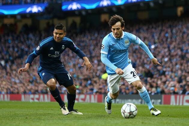 David Silva of Manchester City rounds Casemiro of Real Madrid during the UEFA Champions League Semi Final 1st leg match at the Etihad Stadium. Photo credit should read: Philip Oldham Sportimage EDITORIAL USE ONLY. No use with unauthorised audio, video, data, fixture lists, club league logos or live services. Online in-match use limited to 120 images, no video emulation. No use in betting, games or single club league player publications.