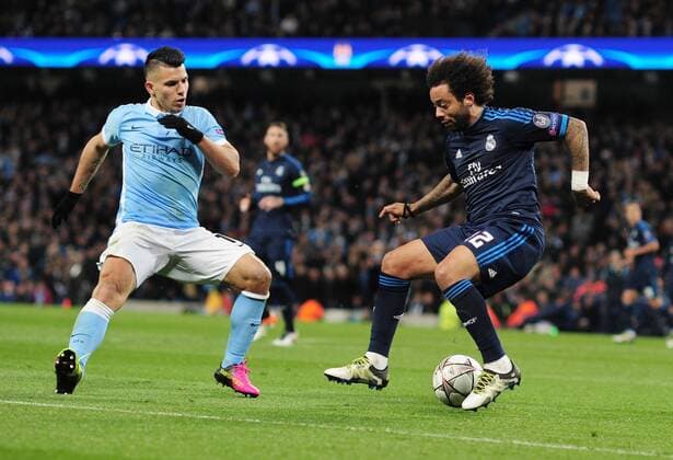 Football - 2015 2016 Champions League - Semi-Final, First Leg: Manchester City vs. Real Madrid Sergio Aguero of Man City and Marcelo of Real Madrid at the Etihad Stadium. COLORSPORT ANDREW COWIE 