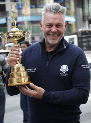 Ryder Cup Captain Darren Clarke of England holds the The Ryder Cup trophy in Times Square after ringing the opening bell at the Nasdaq in New York City on April 28, 2016.  NYP20160428102 JOHNxANGELILLO