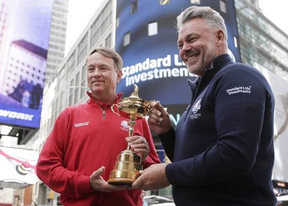 Ryder Cup Captains Davis Love III and Darren Clarke hold the The Ryder Cup trophy in Times Square after they ring the opening bell at the Nasdaq in New York City on April 28, 2016.  NYP20160428106 JOHNxANGELILLO