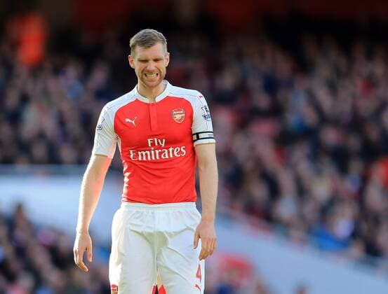 Arsenal s Per Mertesacker looks on dejected during the Barclays Premier League match at the Emirates Stadium. Photo credit should read: David Klein Sportimage EDITORIAL USE ONLY. No use with unauthorised audio, video, data, fixture lists, club league logos or live services. Online in-match use limited to 120 images, no video emulation. No use in betting, games or single club league player publications.