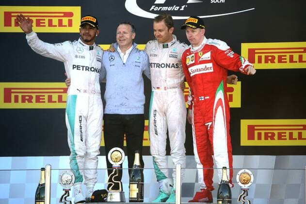 SOCHI, RUSSIA. MAY 1, 2016. 2nd placed British driver Lewis Hamilton (L) of the Mercedes AMG Petronas F1 team, German driver Nico Rosberg (2nd R) of the Mercedes AMG Petronas F1 team, the winner of the 2016 Formula 1 Russian Grand Prix, and 3rd placed Finnish driver Kimi Raikkonen (R) of the Scuderia Ferrari F1 team at an awards ceremony, at the Sochi Autodrom Circuit in Olympic Park. Mikhail Metzel TASS  TS0217DA