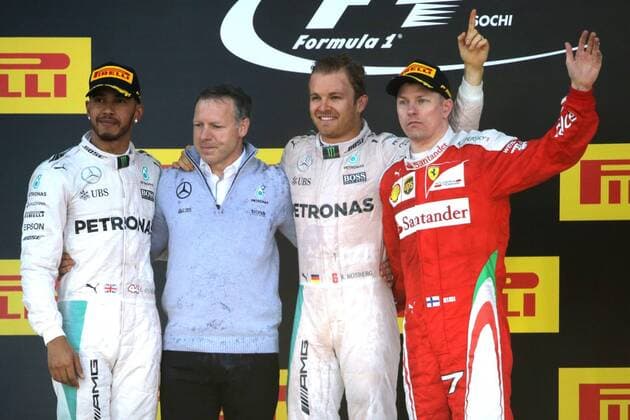 SOCHI, RUSSIA. MAY 1, 2016. 2nd placed British driver Lewis Hamilton (L) of the Mercedes AMG Petronas F1 team, German driver Nico Rosberg (2nd R) of the Mercedes AMG Petronas F1 team, the winner of the 2016 Formula 1 Russian Grand Prix, and 3rd placed Finnish driver Kimi Raikkonen (R) of the Scuderia Ferrari F1 team at an awards ceremony, at the Sochi Autodrom Circuit in Olympic Park. Mikhail Metzel TASS  TS0217D6