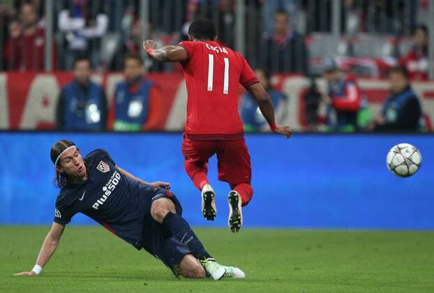 SOCCER - CL, Bayern vs Atletico MUNICH,GERMANY,03.MAY.16 - SOCCER - UEFA Champions League, semifinal, FC Bayern Muenchen vs Atletico Madrid. Image shows Filipe Luis (Atletico) and Douglas Costa (Bayern). GEPAxpictures xThomasxBachun