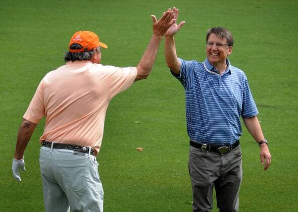 May 4, 2016 - Charlotte, NC, USA - North Carolina Gov. Pat McCrory, right, high fives Felix Sabates on the 16th fairway during a Pro-Am at Quail Hollow Club in Charlotte, N.C. on Wednesday, May 4, 2016. Wells Fargo Pro-Am - ZUMAm67_